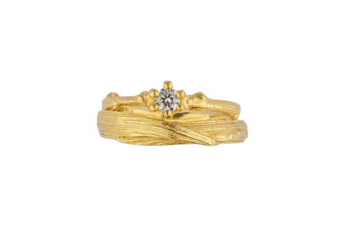Claw set diamond twig ring with meadow grass band.